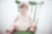 Child in Green Chair